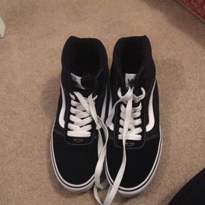 Black high top Vans.